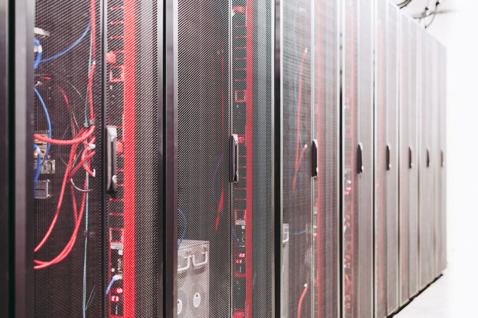 Enterprise data-center racks with network equipment, cabling and operational infrastructure.