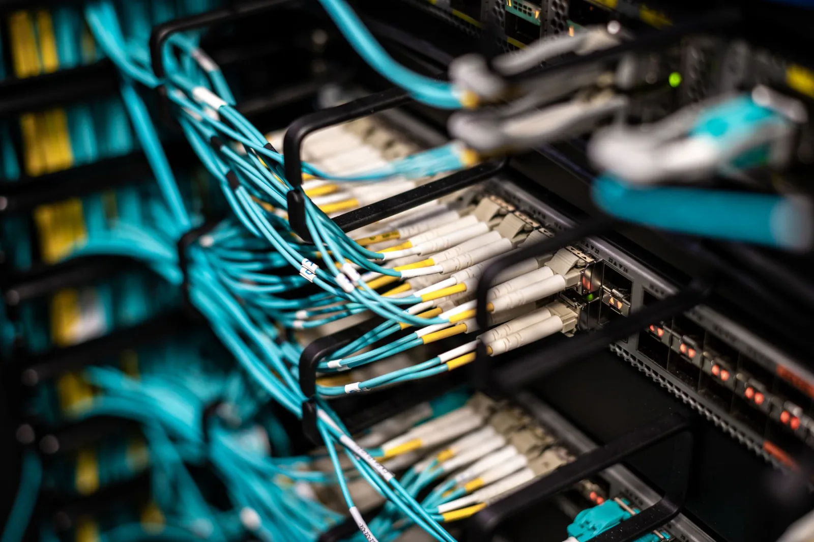 Fiber and network connections installed inside enterprise switching infrastructure.