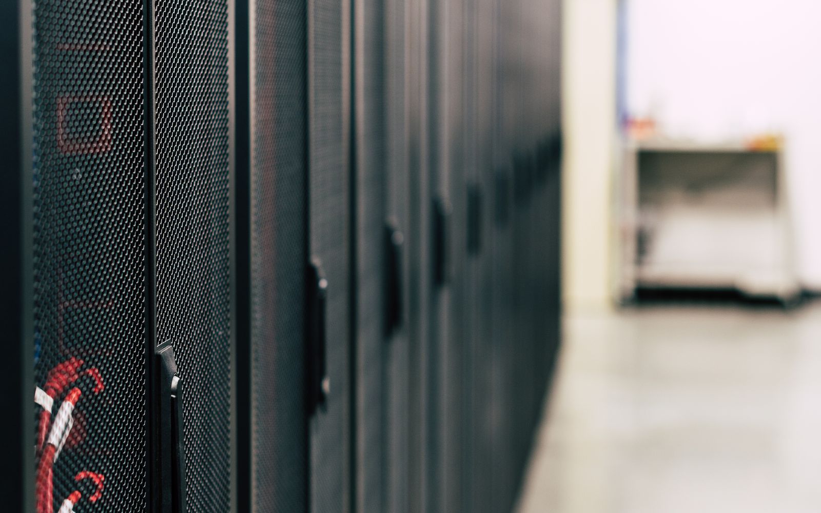 Modern data-center server rows representing cloud-connected and hybrid infrastructure.